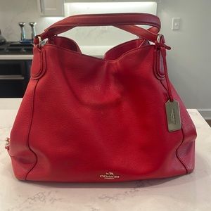 Coach Orange leather shoulder bag.